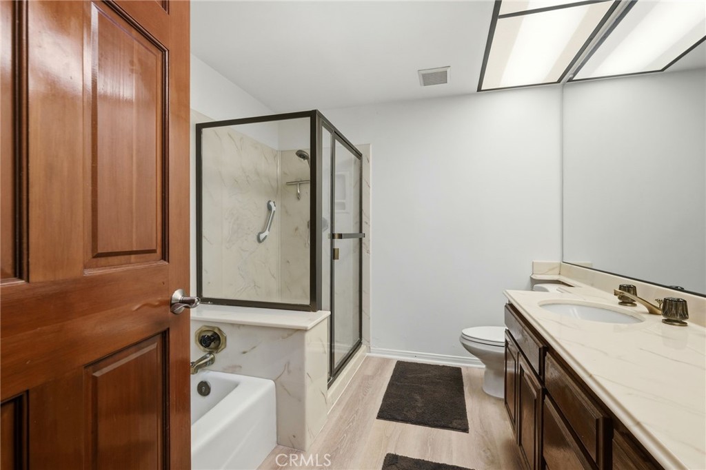 18233 Charlton Lane Porter Ranch, CA 91326 - Photo 15 of 40 a bathroom with a sink and a mirror