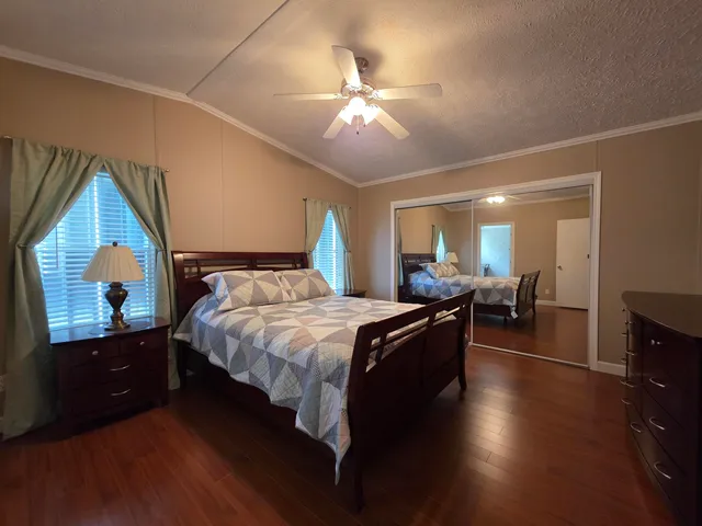 a bed room with a bed and a television