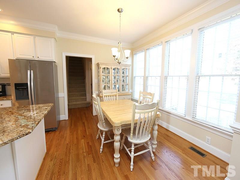 4100 Heathgate Lane Raleigh, NC 27613 - Photo 11 of 25 a view of a dining room with furniture window and wooden floor