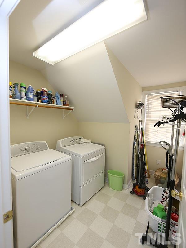 4100 Heathgate Lane Raleigh, NC 27613 - Photo 20 of 25 a view of storage and utility room with washer and dryer