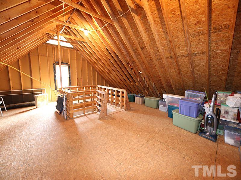 4100 Heathgate Lane Raleigh, NC 27613 - Photo 22 of 25 a view of a room with racks on the wall