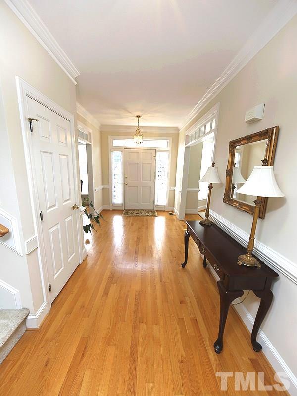 4100 Heathgate Lane Raleigh, NC 27613 - Photo 5 of 25 a living room with furniture and a wooden floor