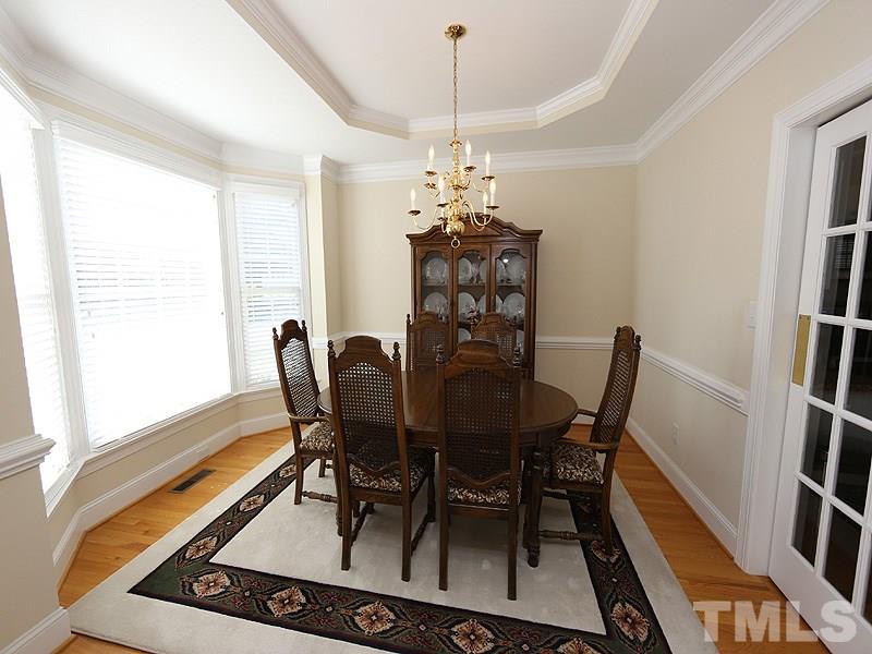 4100 Heathgate Lane Raleigh, NC 27613 - Photo 6 of 25 a view of a dining room with furniture and a window