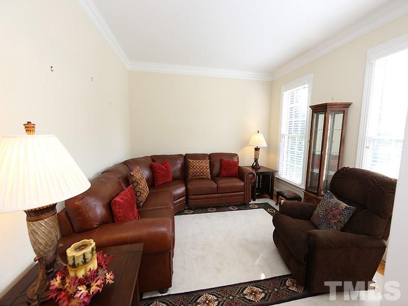 4100 Heathgate Lane Raleigh, NC 27613 - Photo 7 of 25 a living room with furniture and a window