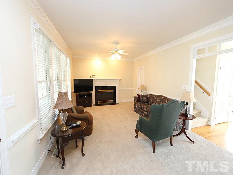 4100 Heathgate Lane Raleigh, NC 27613 - Photo 8 of 25 a living room with furniture and a fireplace