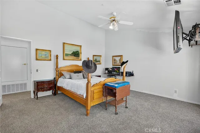 a spacious bathroom with a sink and a mirror