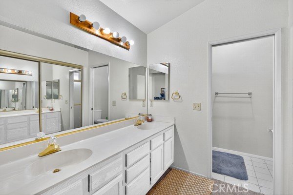34215 Simla Street Acton, CA 93510 - Photo 21 of 37 a spacious bathroom with a sink and a mirror