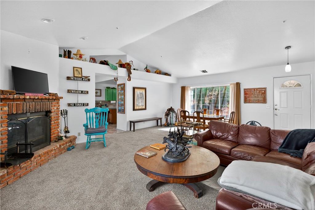 34215 Simla Street Acton, CA 93510 - Photo 8 of 37 a living room with furniture and a fireplace