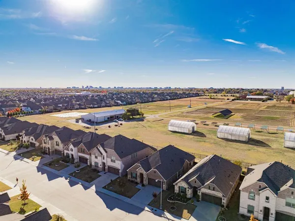 an aerial view of a house with a ocean view