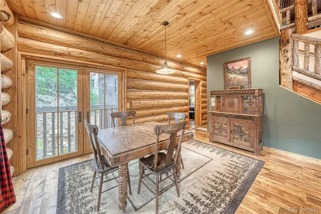 a view of a room with furniture and wooden floor