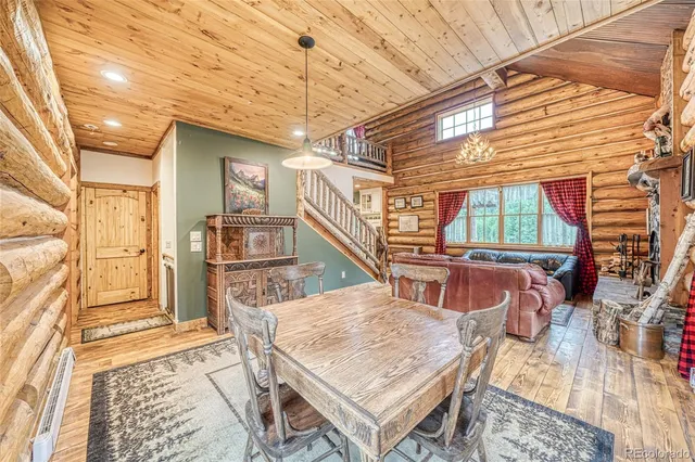 a dining room with a table and chairs