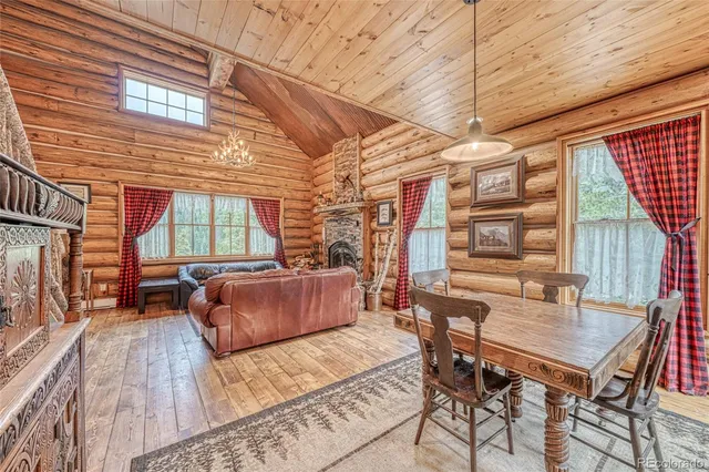 a dinning table and chairs in patio of the house