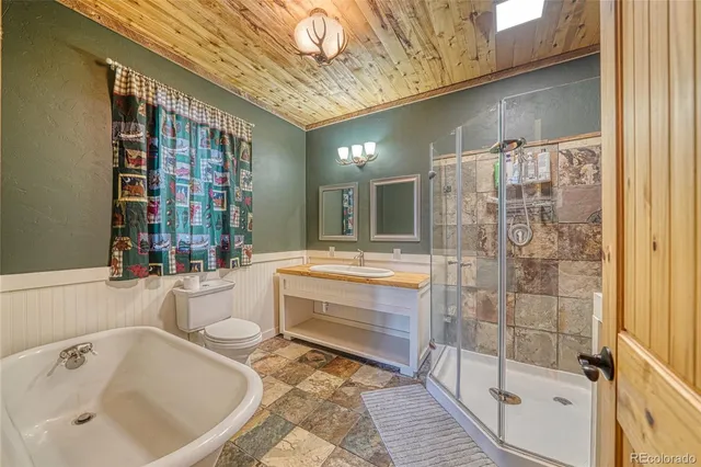 a bathroom with a bathtub and shower