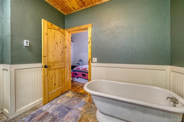 a bathroom with a bathtub and a shower