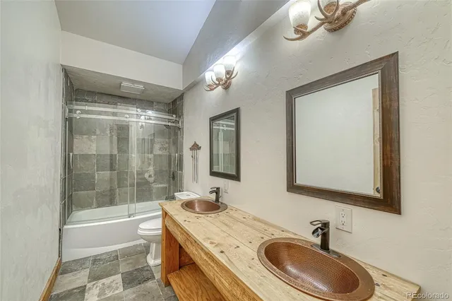 a bathroom with a sink double vanity and a mirror