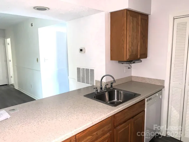 a kitchen with a sink and a microwave