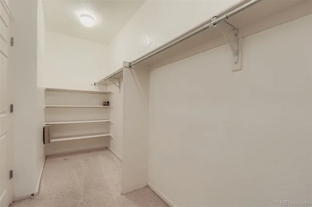 a bed room with a bed and a window