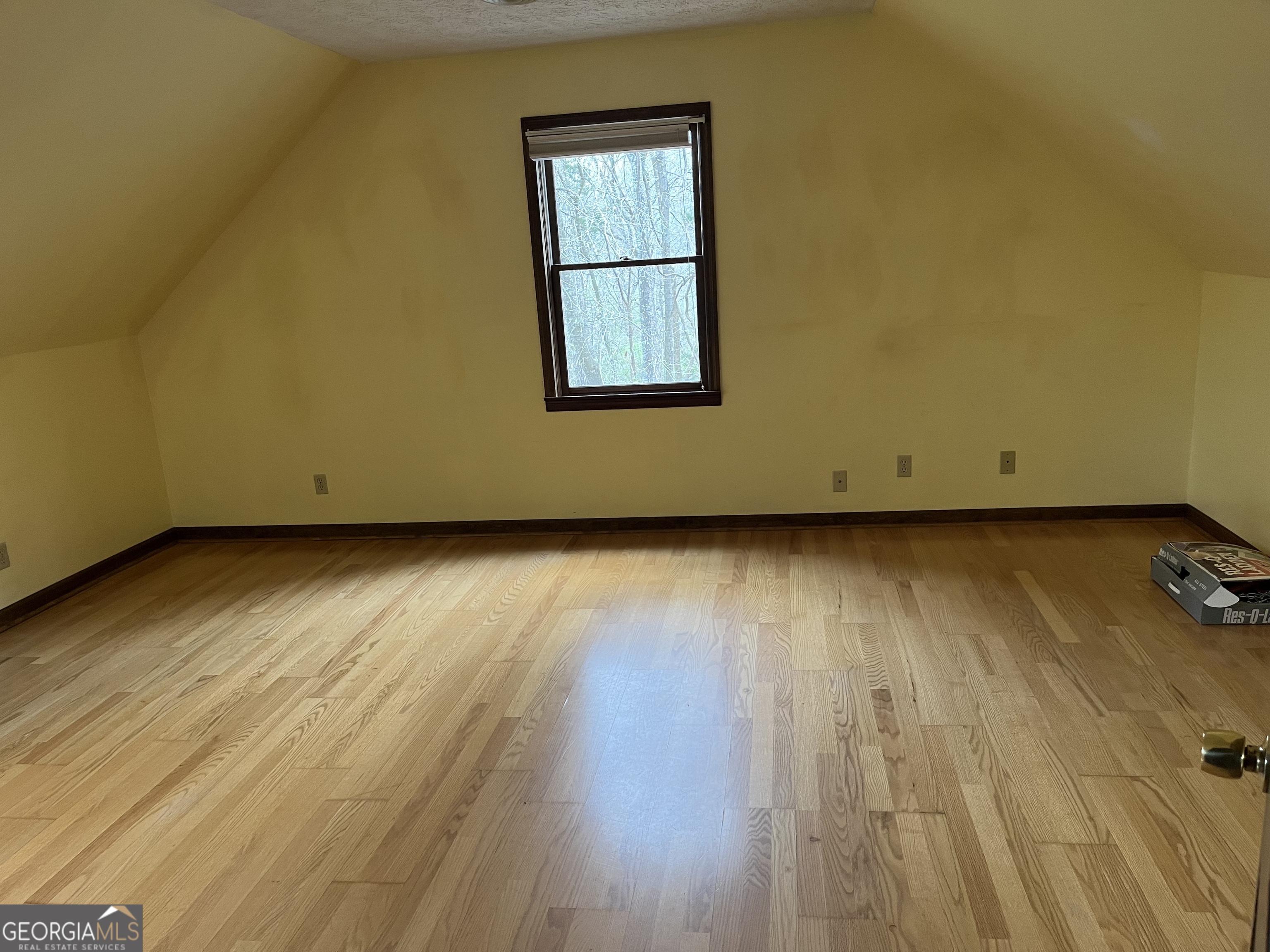 475 Davis Road Southwest Cave Spring, GA 30124 - Photo 13 of 27 an empty room with wooden floor and windows