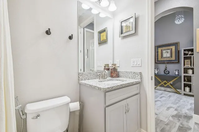 a kitchen with stainless steel appliances kitchen island granite countertop a refrigerator and cabinets