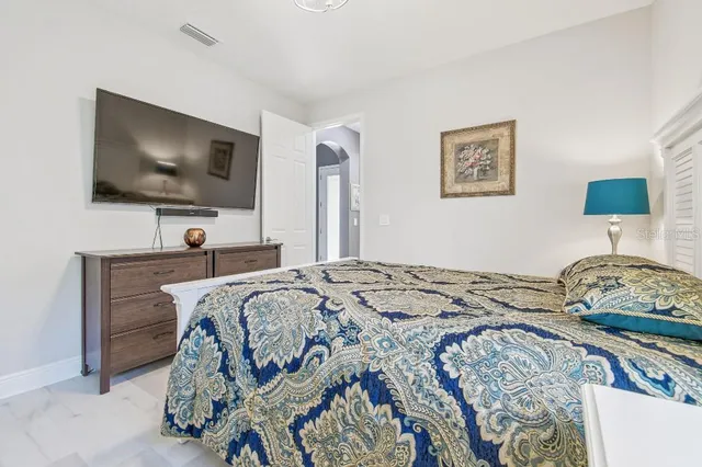 a large kitchen with kitchen island a sink table and chairs