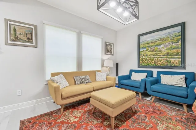 a bathroom with a granite countertop sink mirror vanity and toilet