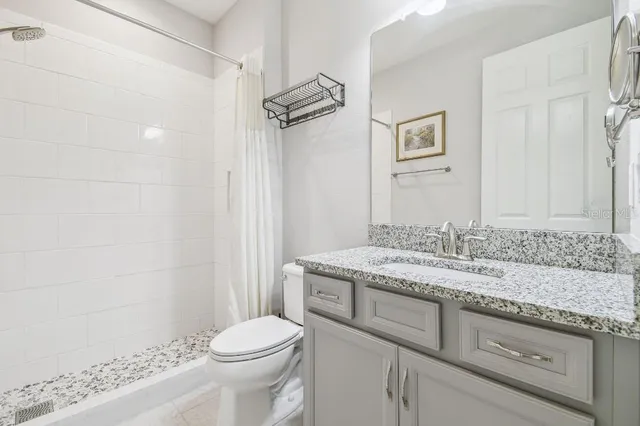 a bathroom with a shower and a bathtub