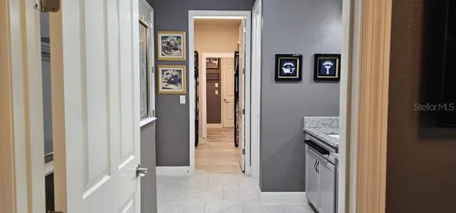 a view of walk in closet with clothes