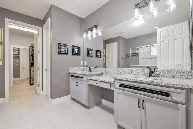 a view of walk in closet with clothes