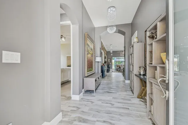 a view of a livingroom with furniture and a flat screen tv