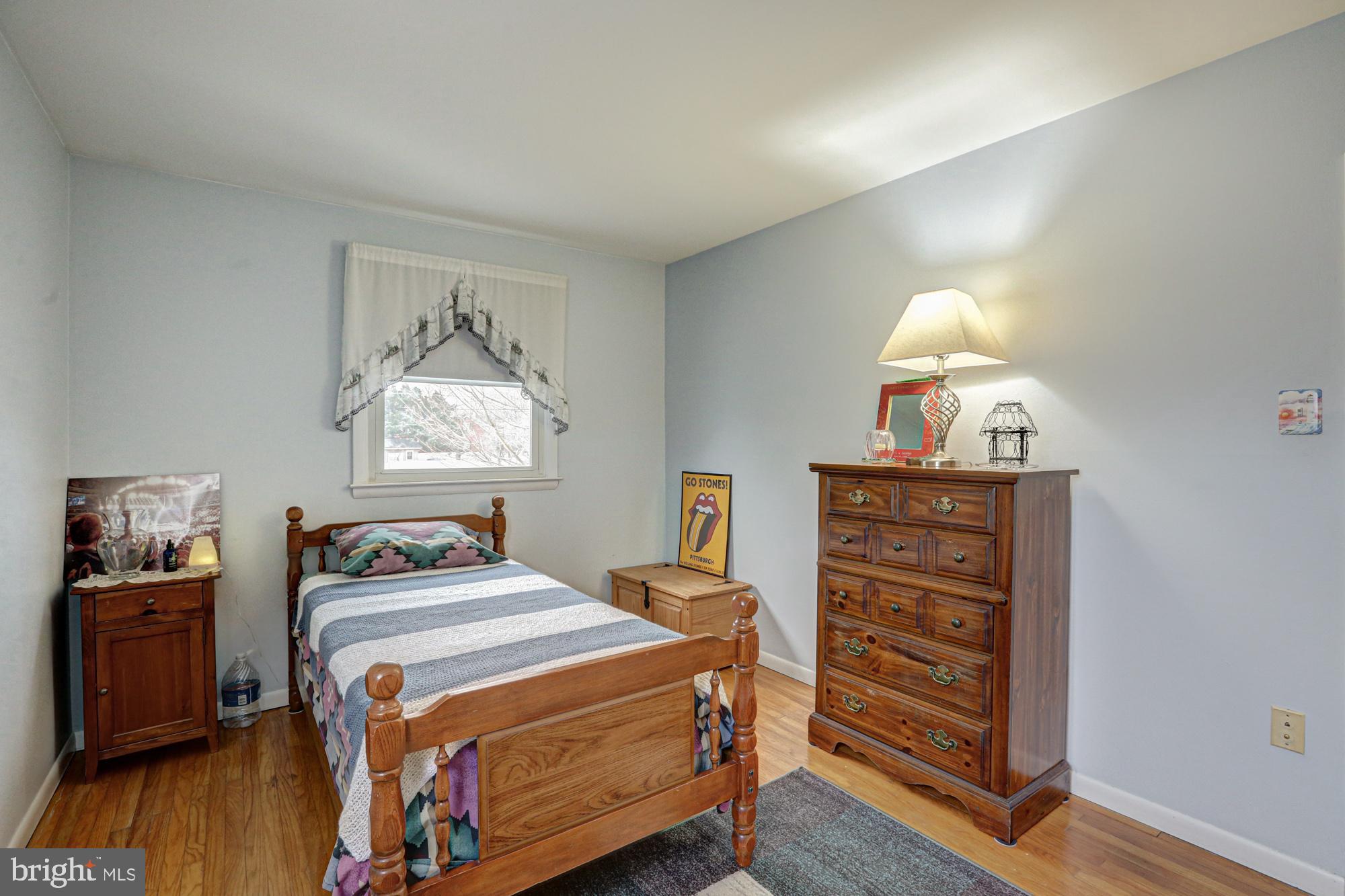 4 Old Forge Road Pennsville, NJ 08070 - Photo 16 of 61 a bedroom with a bed and a lamp on dresser