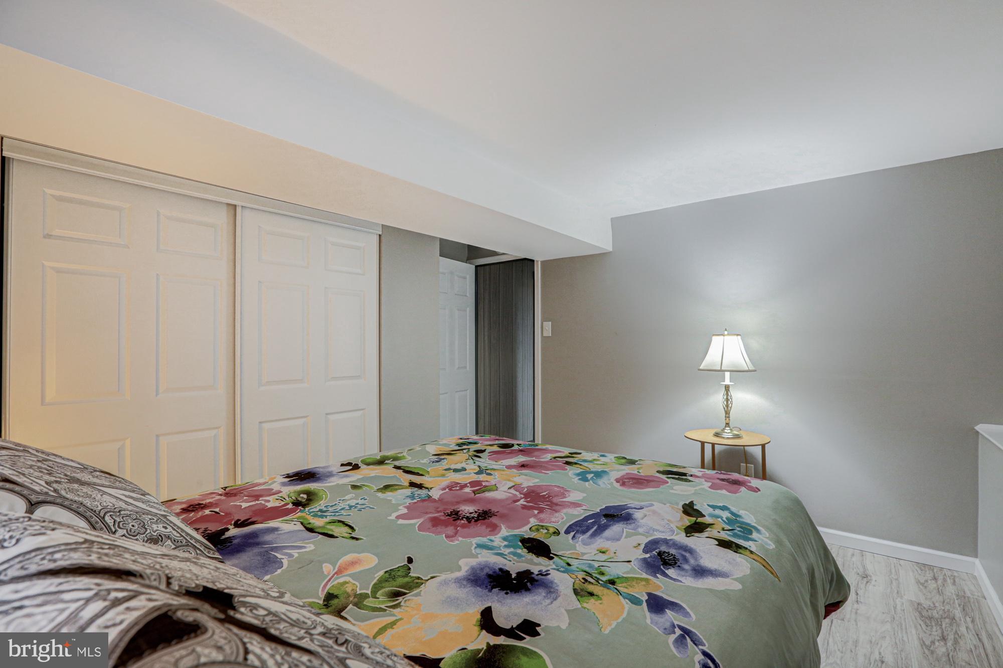 4 Old Forge Road Pennsville, NJ 08070 - Photo 18 of 61 a bed room with a bed and a lamp