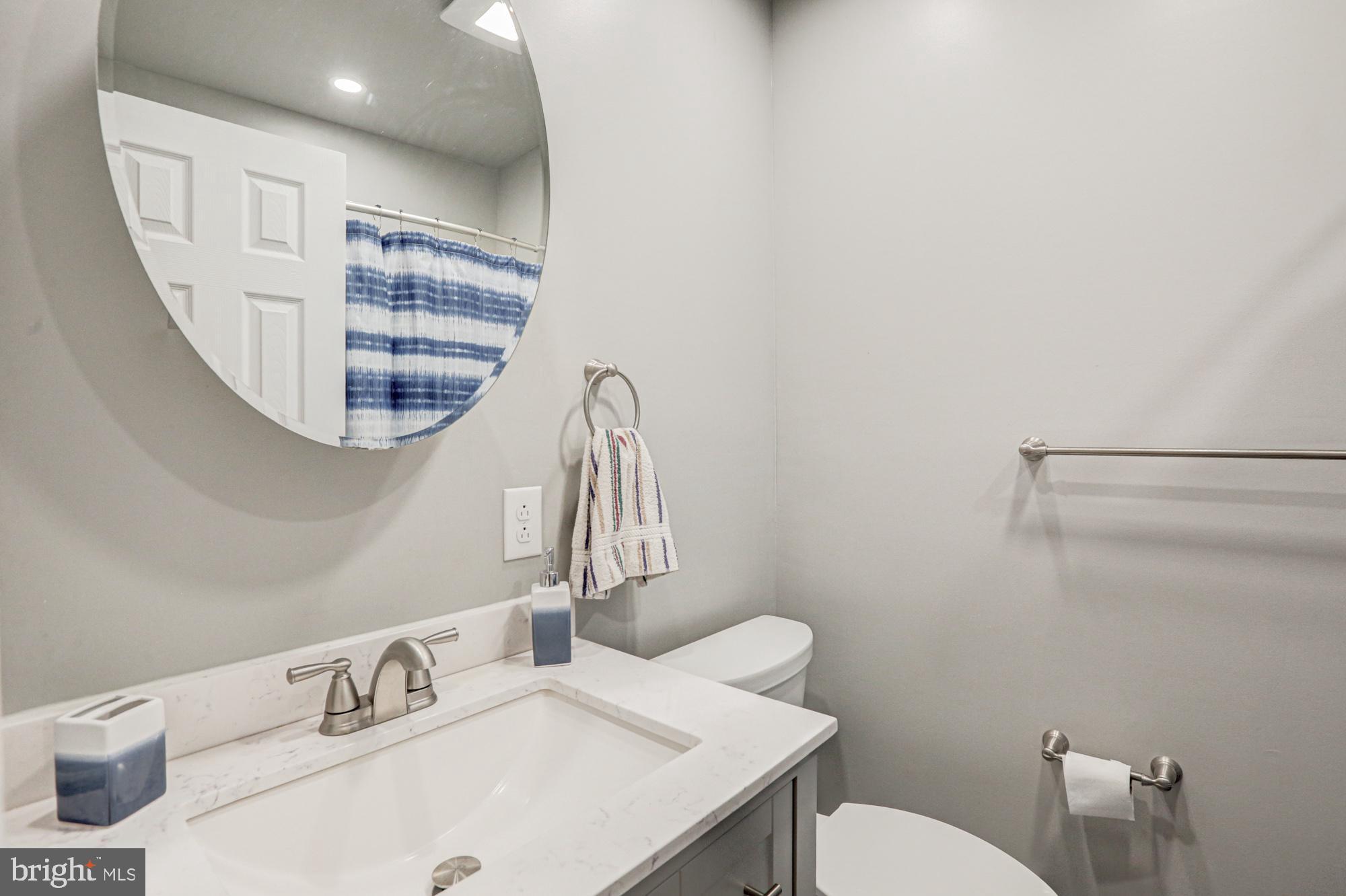 4 Old Forge Road Pennsville, NJ 08070 - Photo 19 of 61 a bathroom with a sink a toilet and a mirror