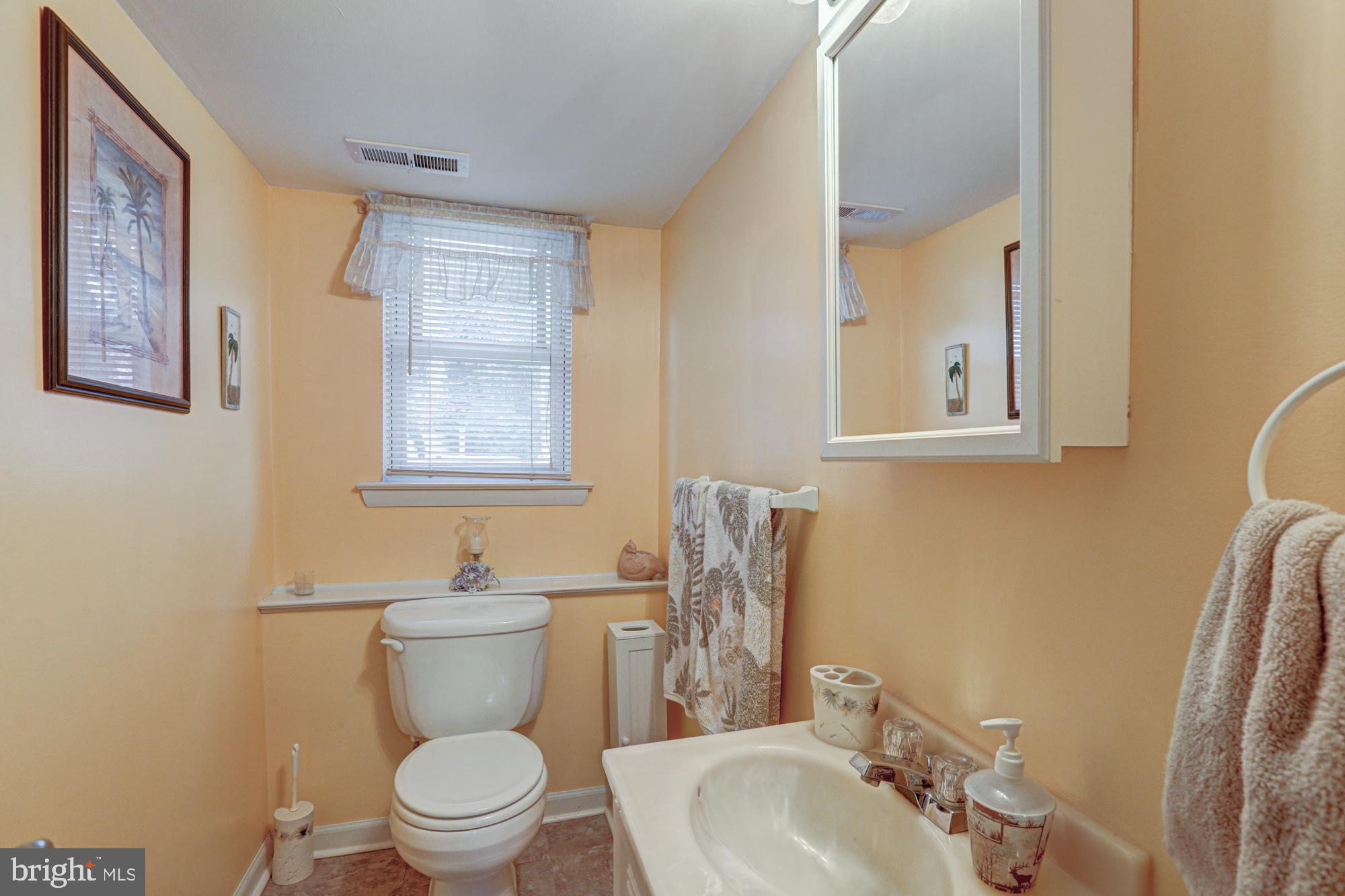 4 Old Forge Road Pennsville, NJ 08070 - Photo 20 of 61 a bathroom with a toilet a sink and mirror