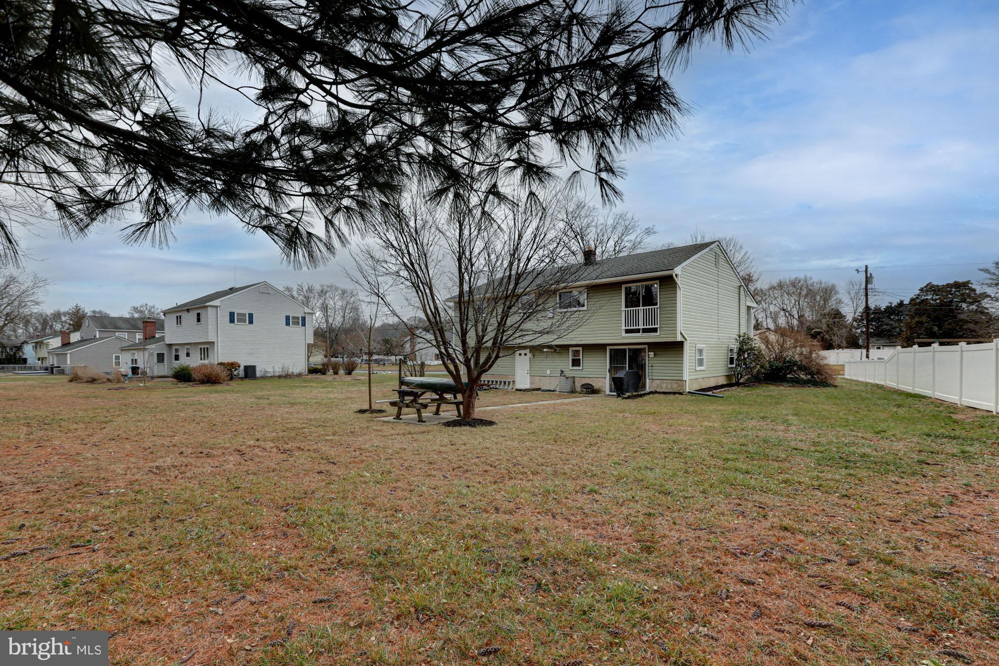 4 Old Forge Road Pennsville, NJ 08070 - Photo 3 of 61 a front view of a house with a yard and garage