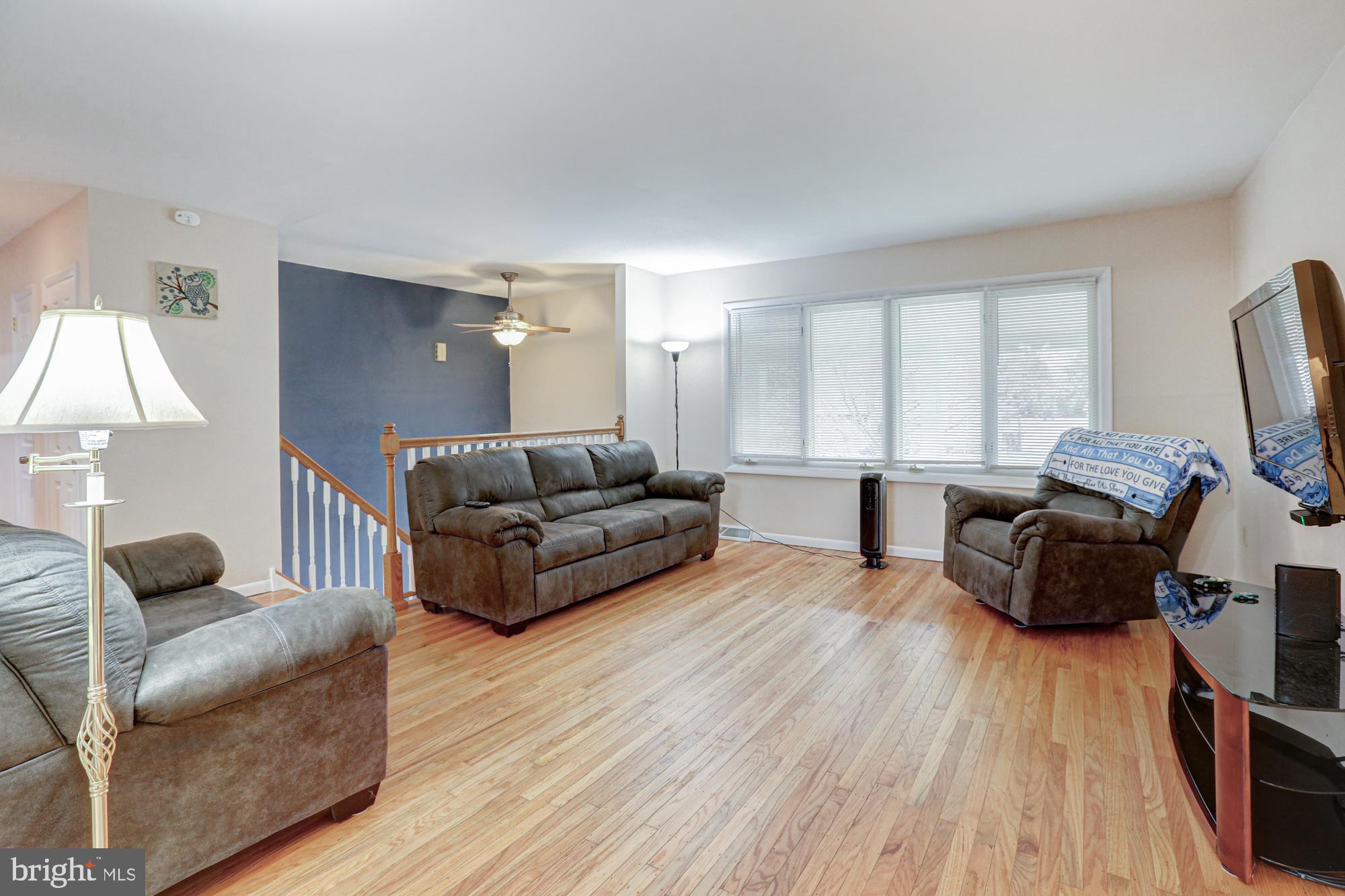 4 Old Forge Road Pennsville, NJ 08070 - Photo 32 of 61 a living room with furniture and a flat screen tv