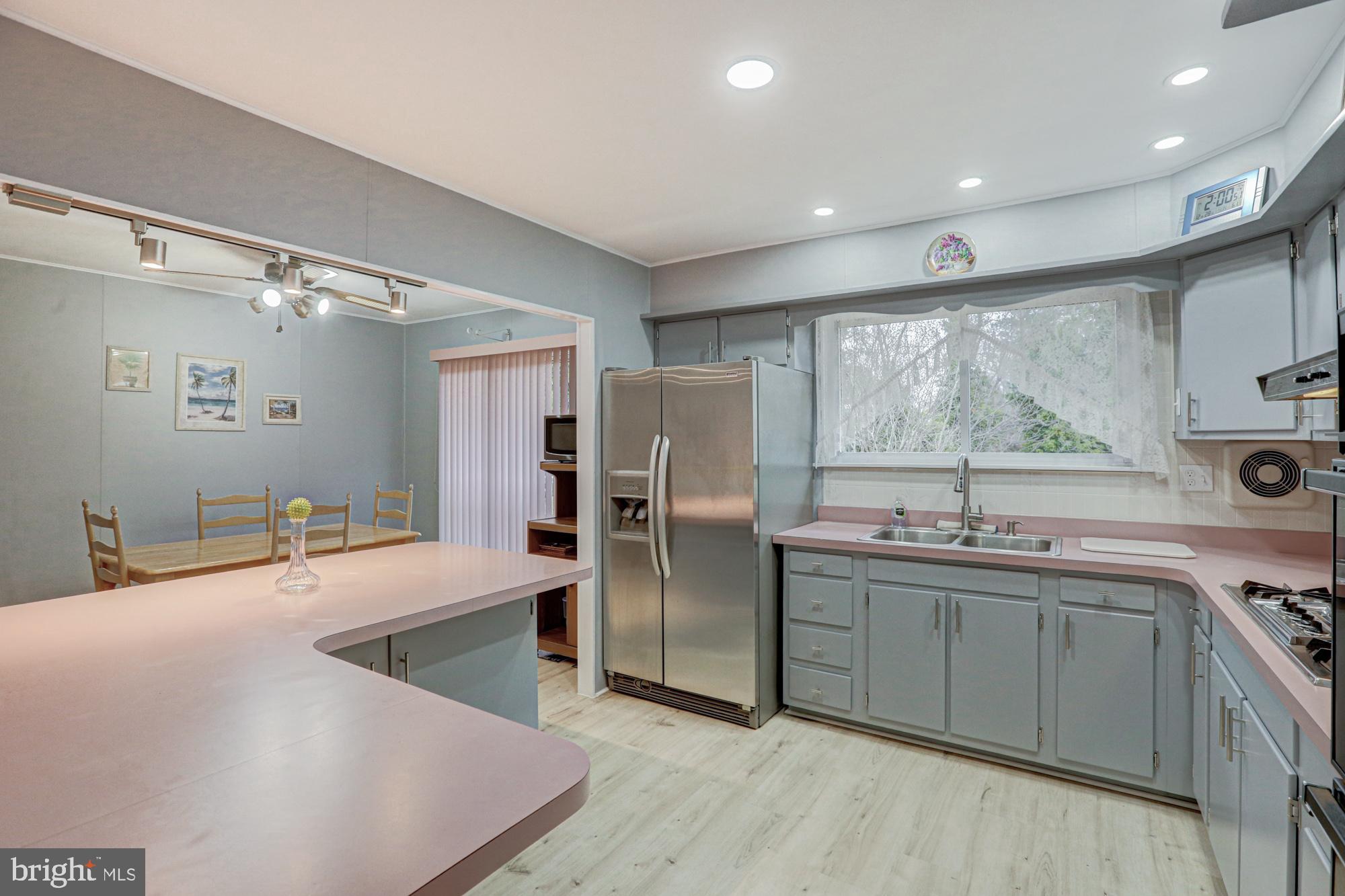 4 Old Forge Road Pennsville, NJ 08070 - Photo 37 of 61 a kitchen with stainless steel appliances granite countertop a sink stove and refrigerator