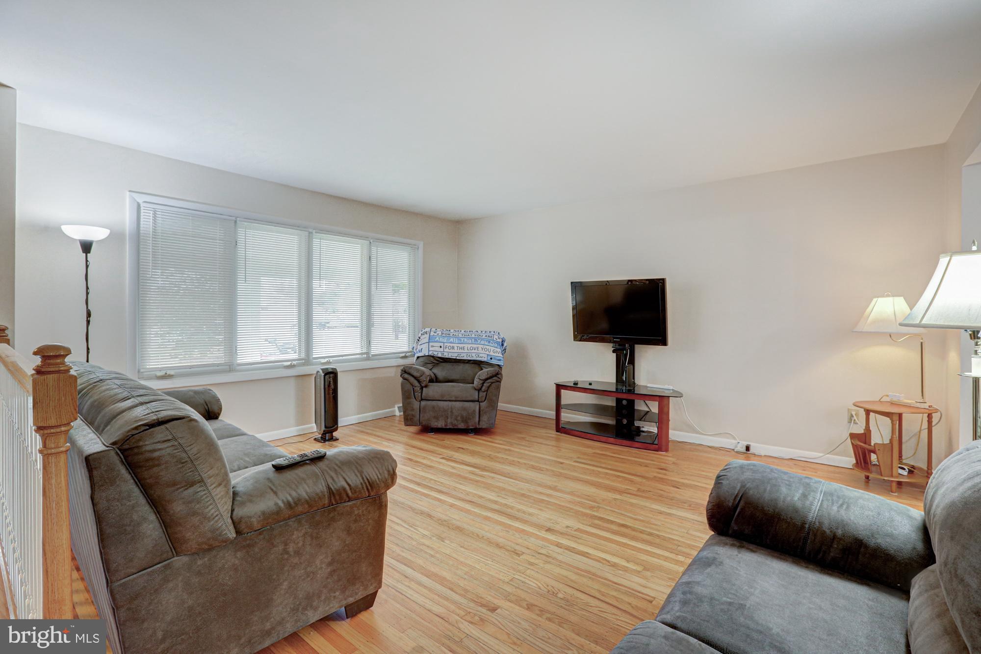 4 Old Forge Road Pennsville, NJ 08070 - Photo 6 of 61 a living room with furniture and a flat screen tv