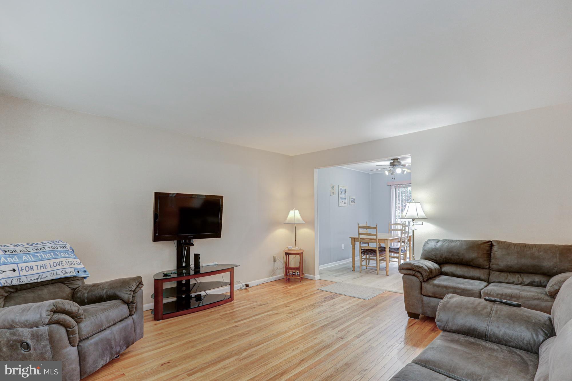 4 Old Forge Road Pennsville, NJ 08070 - Photo 7 of 61 a living room with furniture and a flat screen tv
