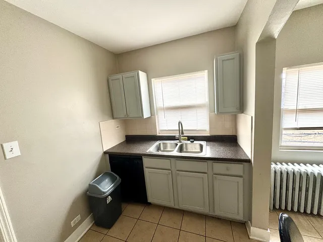 a room with wooden floor and furniture