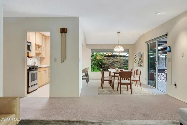 a view of a dining room with furniture window and outside view