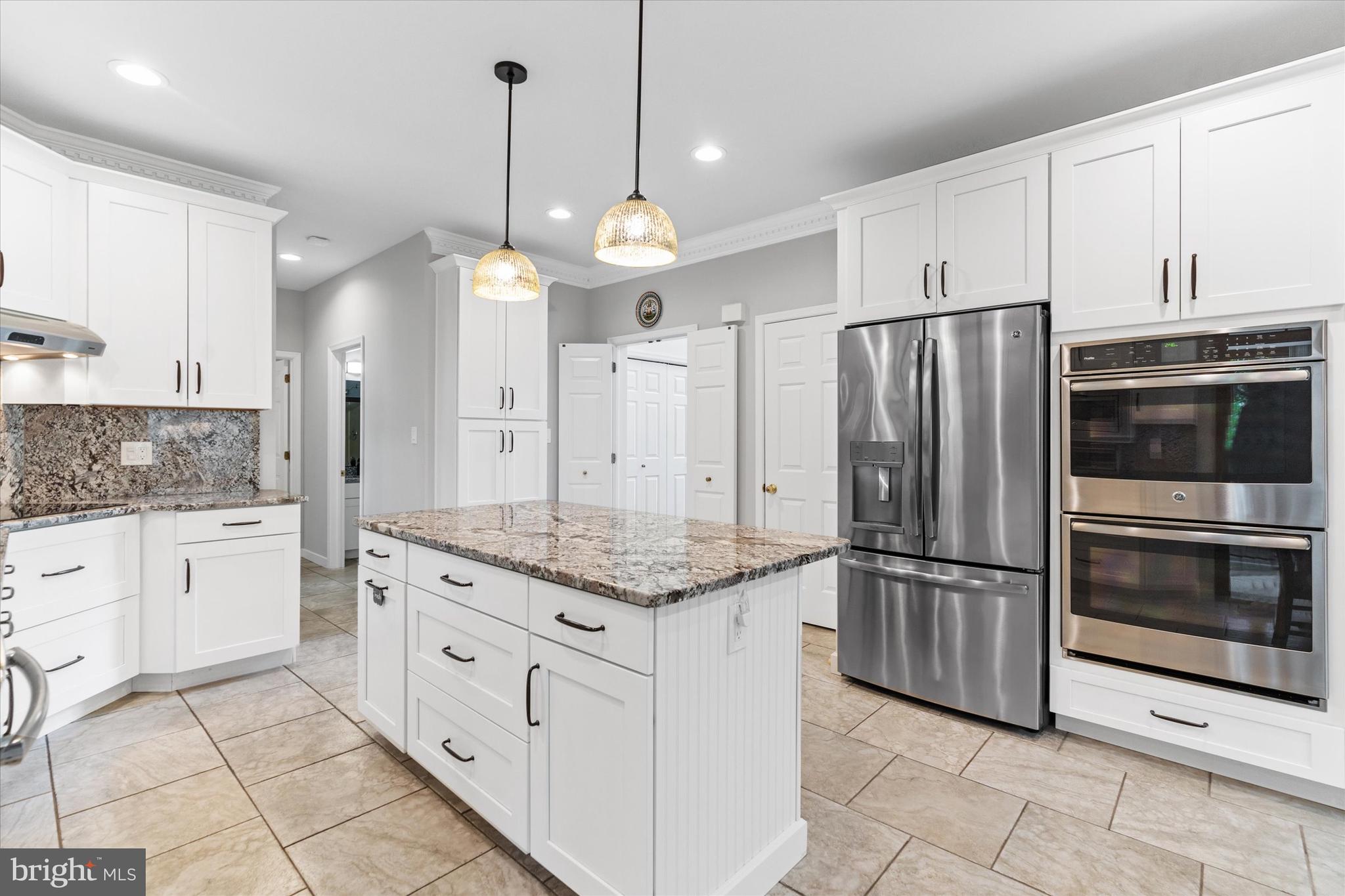 216 South Pond Road Hockessin, DE 19707 - Photo 13 of 61 a kitchen with stainless steel appliances granite countertop a refrigerator and a sink