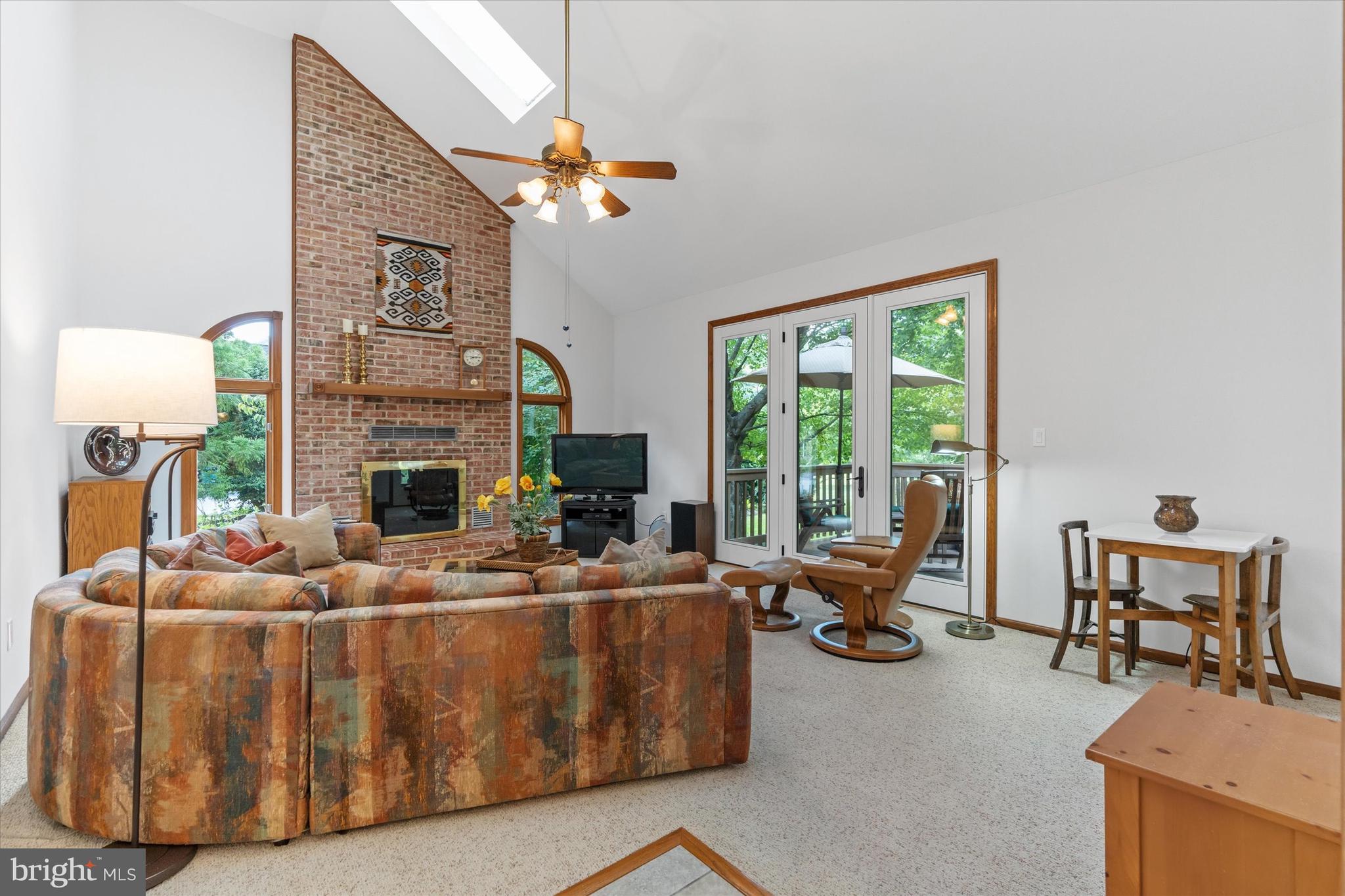 216 South Pond Road Hockessin, DE 19707 - Photo 17 of 61 a living room with furniture and a fireplace