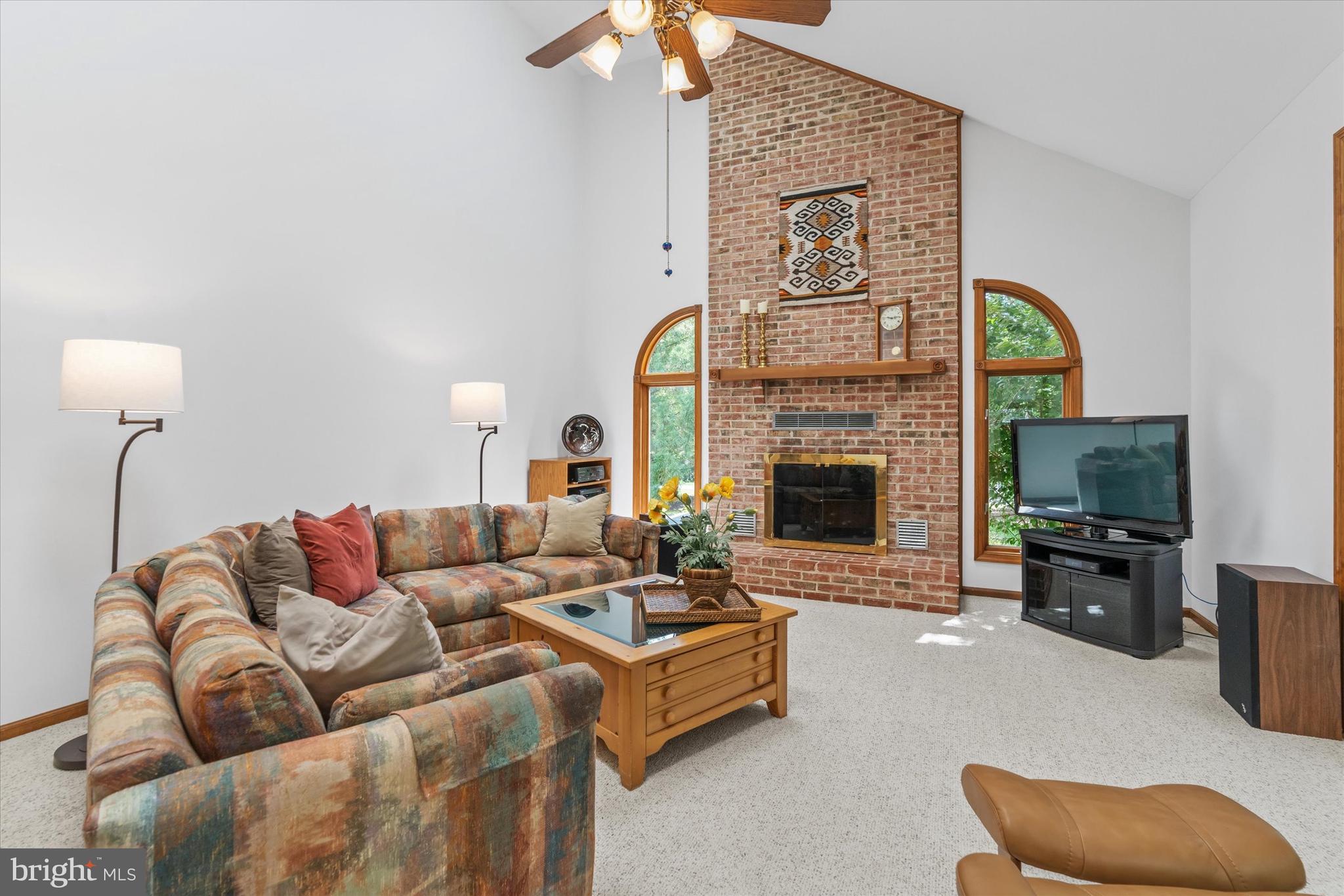 216 South Pond Road Hockessin, DE 19707 - Photo 18 of 61 a living room with furniture fireplace and flat screen tv