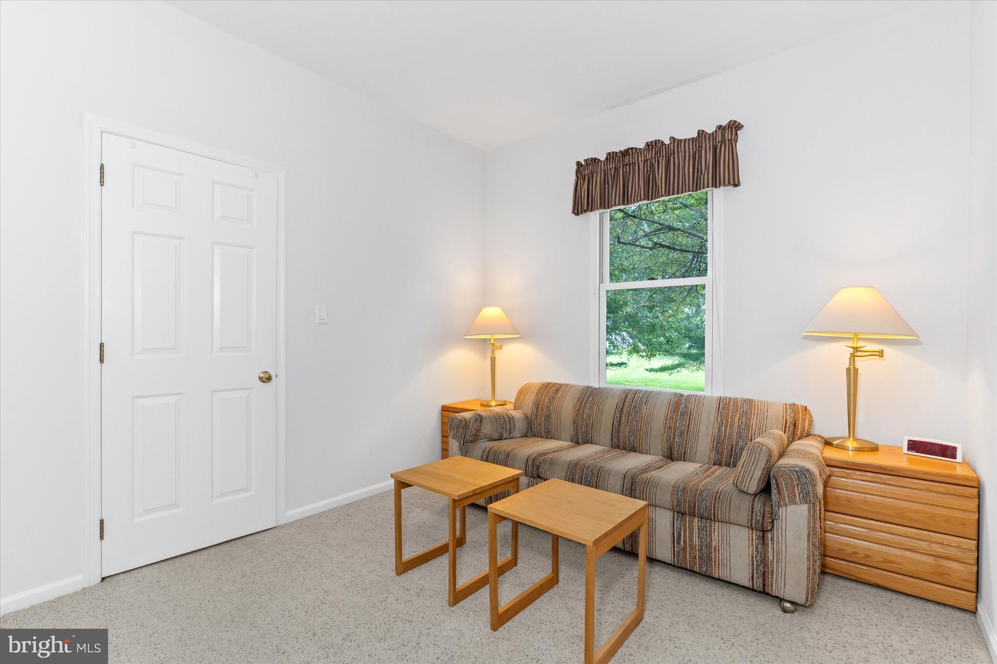 216 South Pond Road Hockessin, DE 19707 - Photo 23 of 61 a living room with furniture and a window