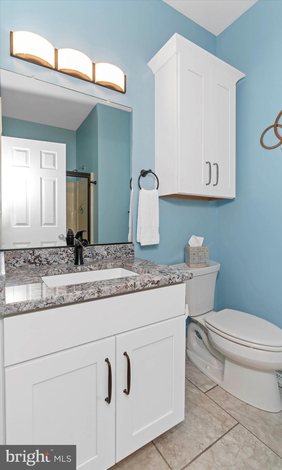 216 South Pond Road Hockessin, DE 19707 - Photo 25 of 61 a bathroom with a granite countertop toilet sink and mirror