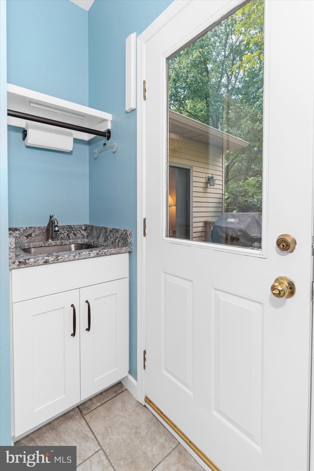 216 South Pond Road Hockessin, DE 19707 - Photo 27 of 61 a bathroom with a granite countertop sink and a mirror