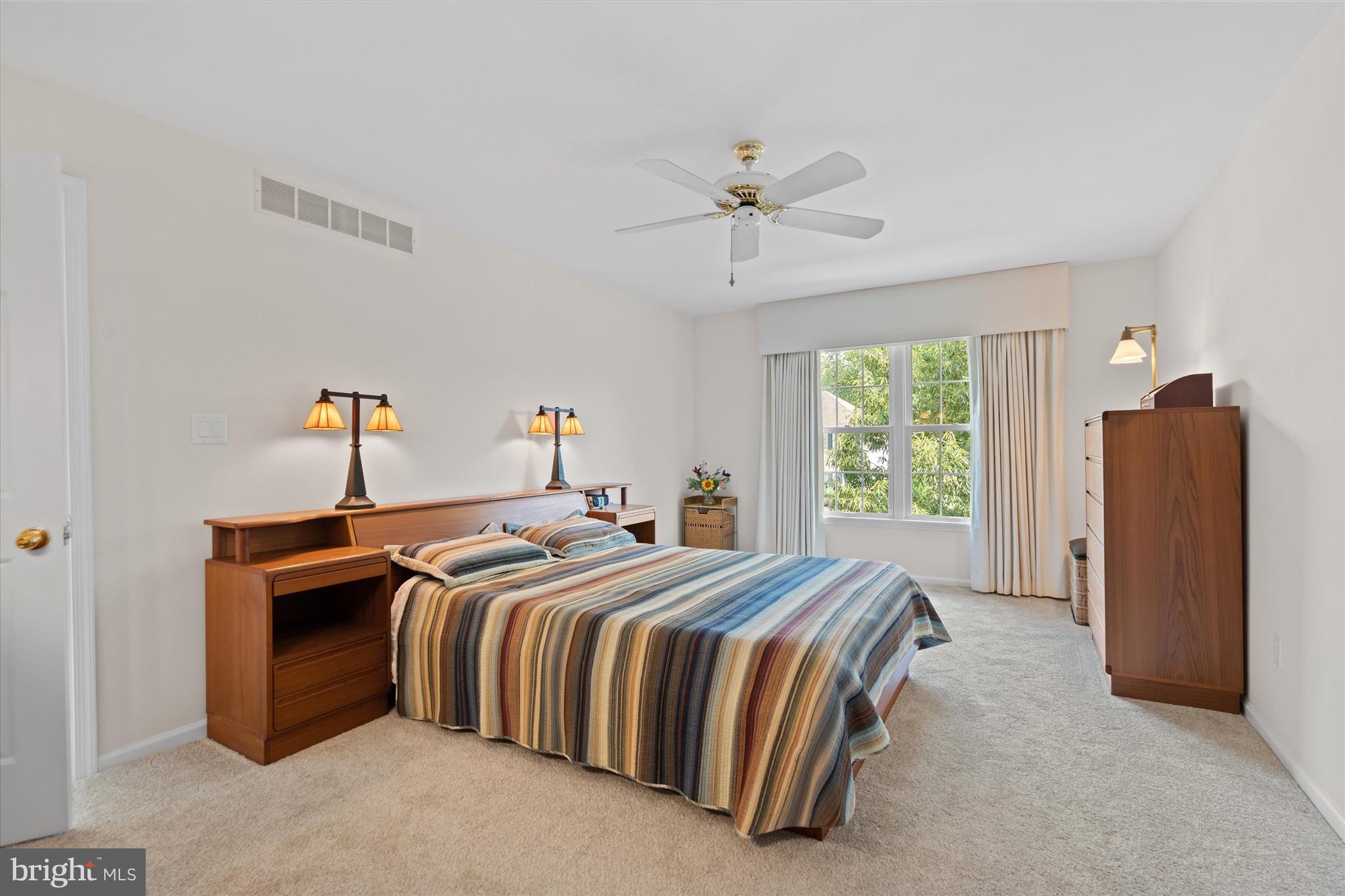 216 South Pond Road Hockessin, DE 19707 - Photo 28 of 61 a bedroom with a bed and a chandelier