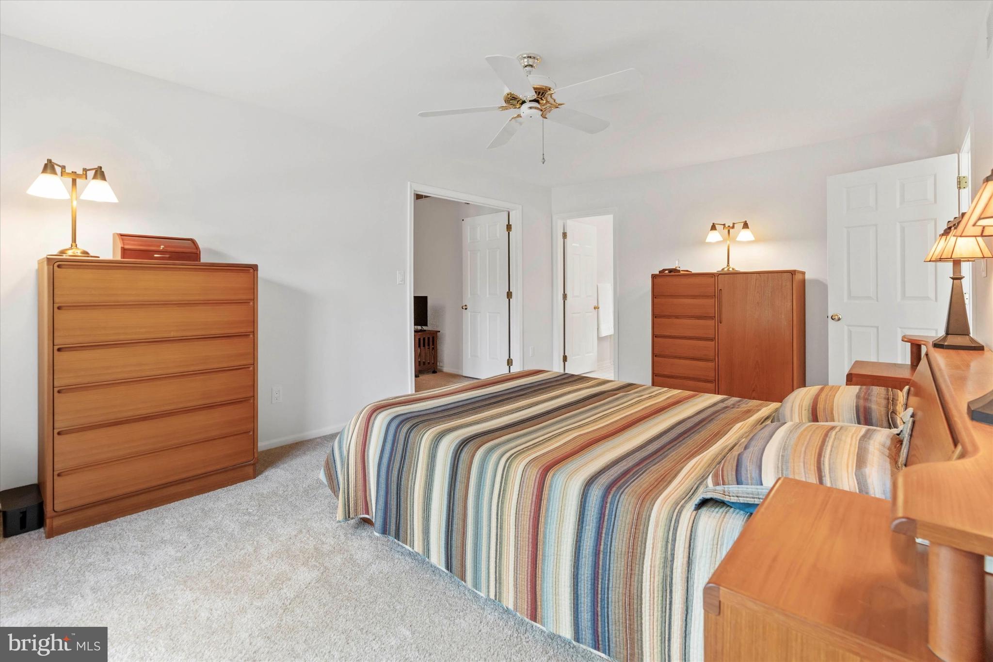 216 South Pond Road Hockessin, DE 19707 - Photo 30 of 61 a bedroom with a bed and a dresser