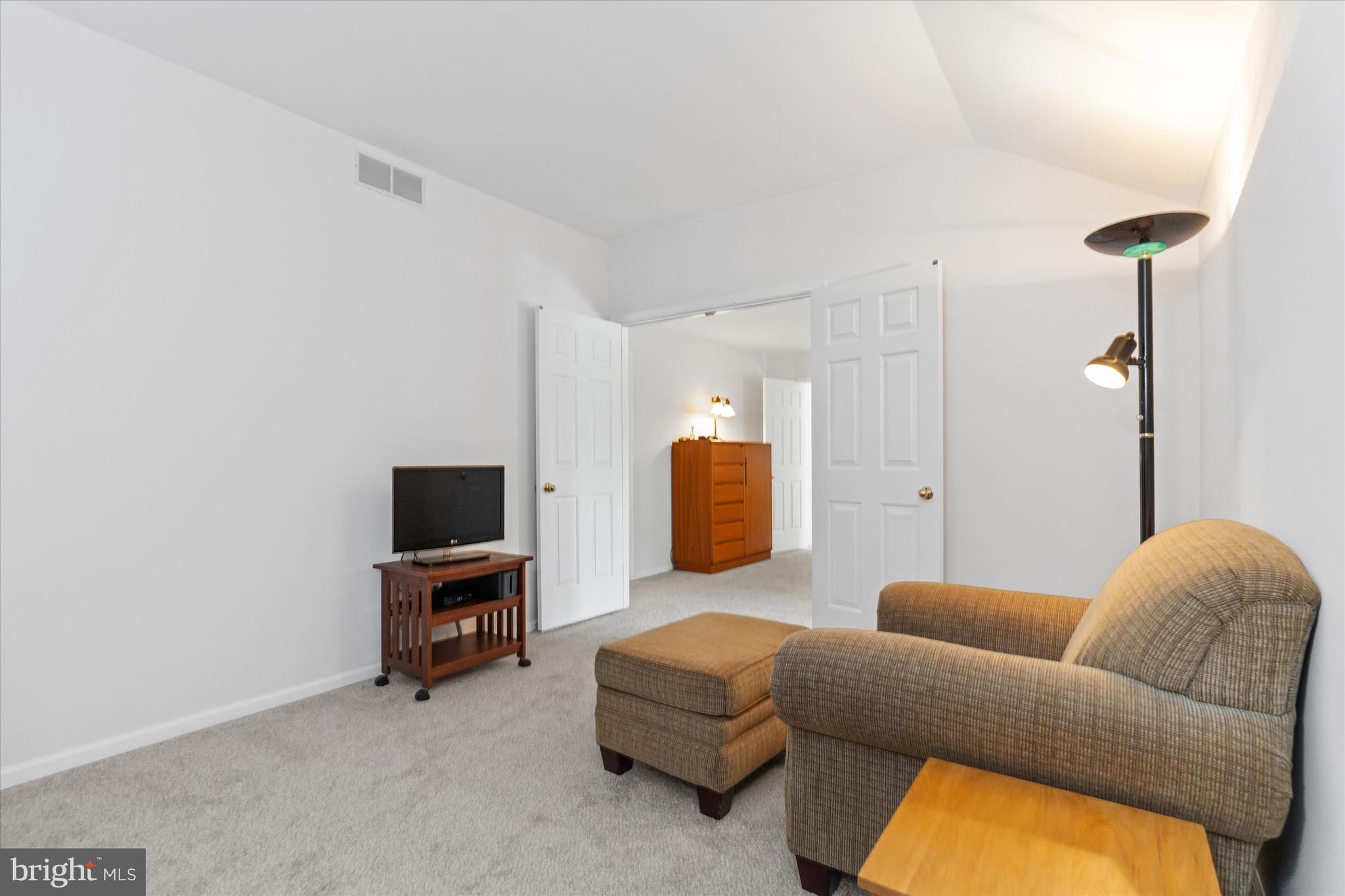 216 South Pond Road Hockessin, DE 19707 - Photo 32 of 61 a living room with furniture and a flat screen tv