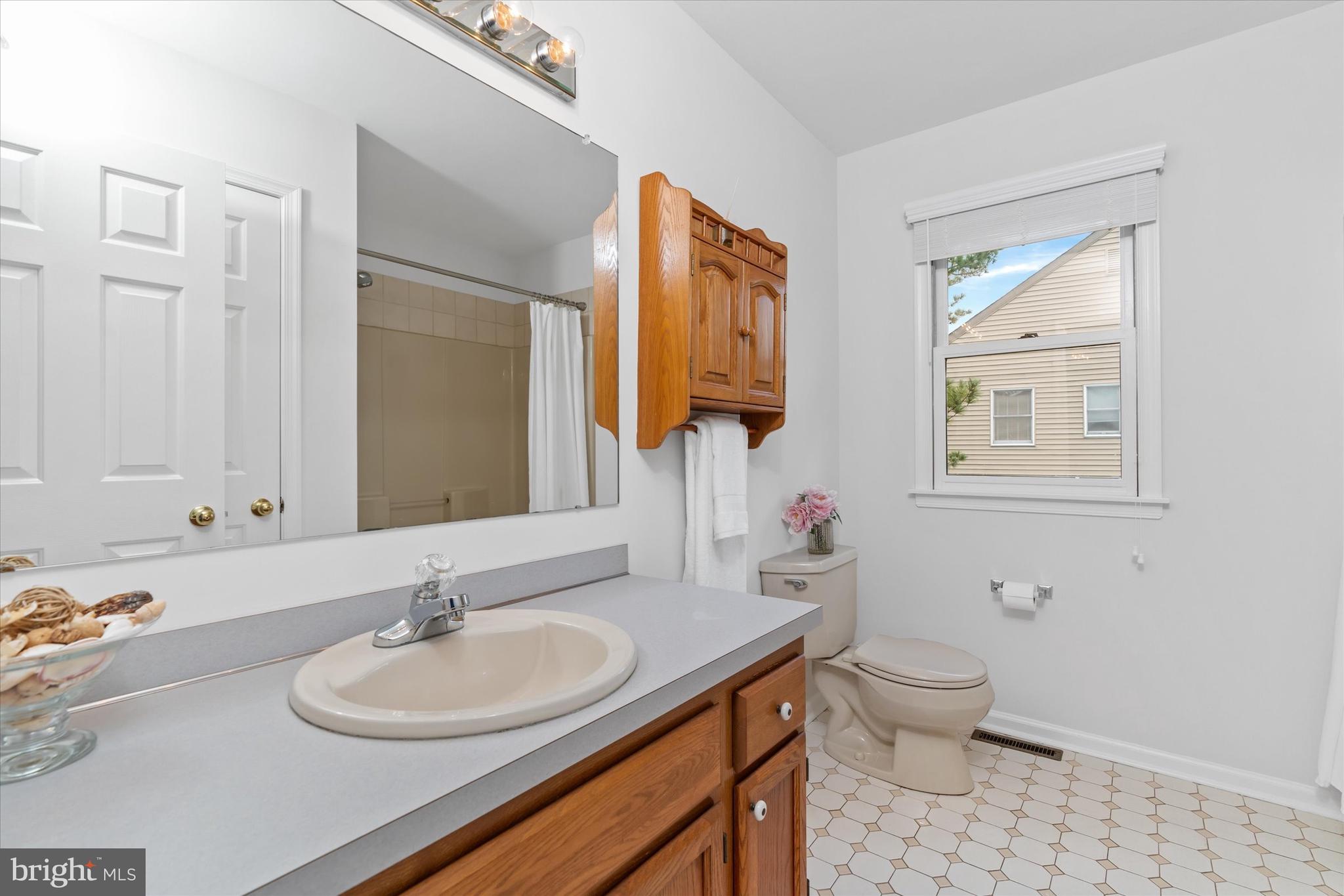 216 South Pond Road Hockessin, DE 19707 - Photo 41 of 61 a bathroom with a toilet sink and mirror
